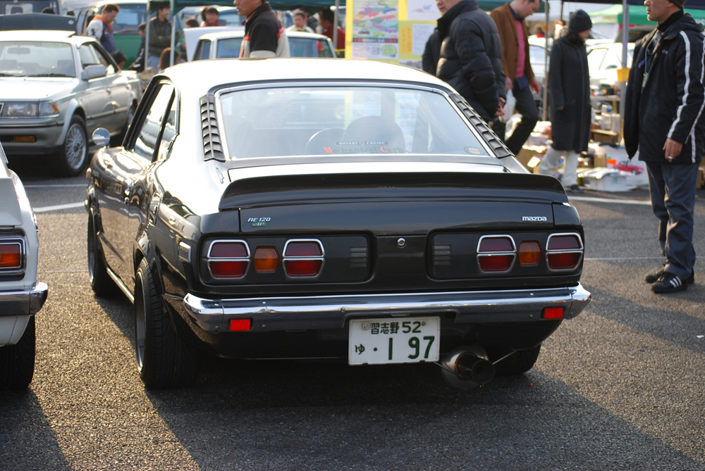 Cool shot of an Mazda RX3 I like the baby muscle car looks of the RX3 coupe 